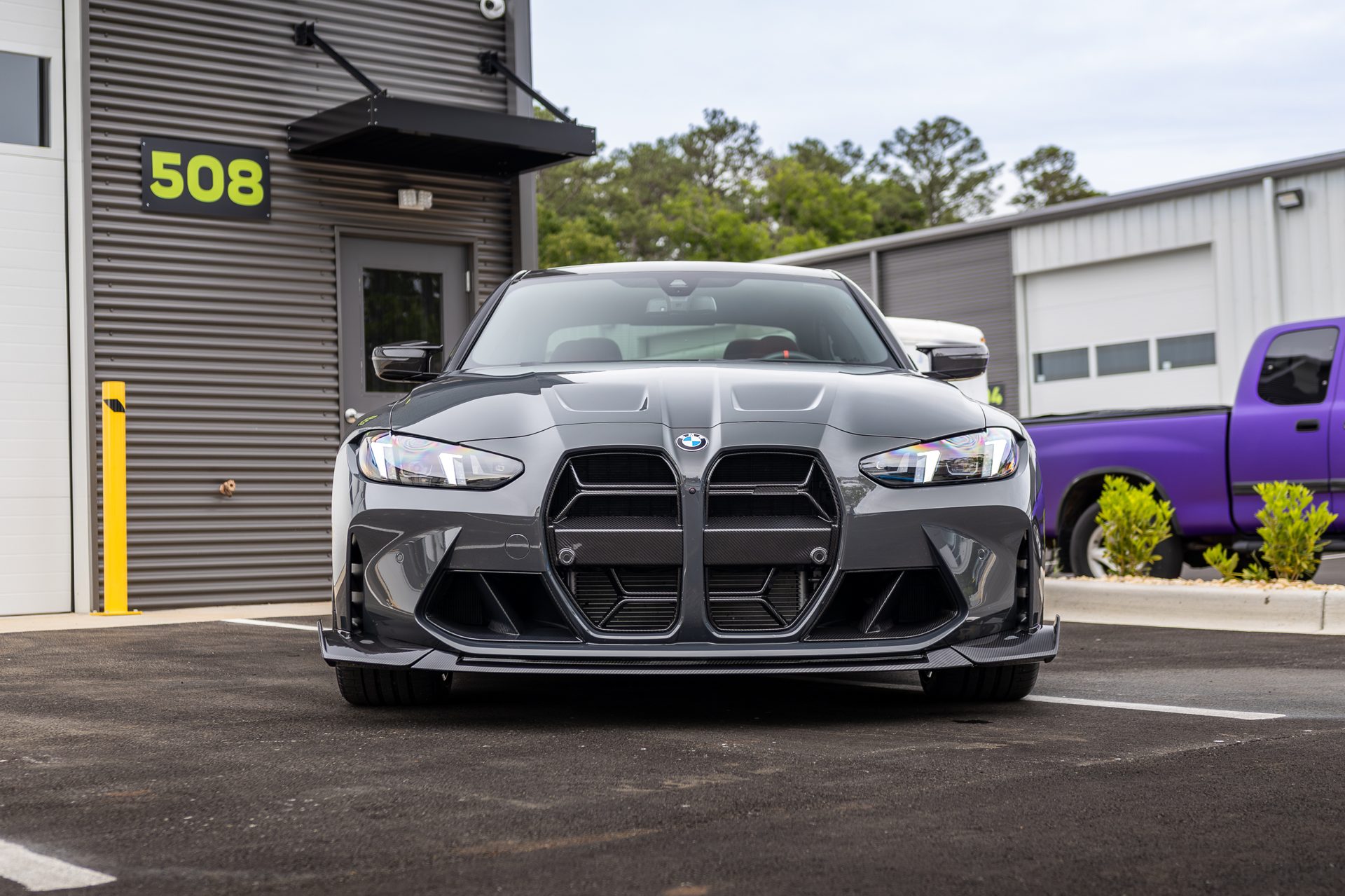 BMW M4 detailed outside the shop