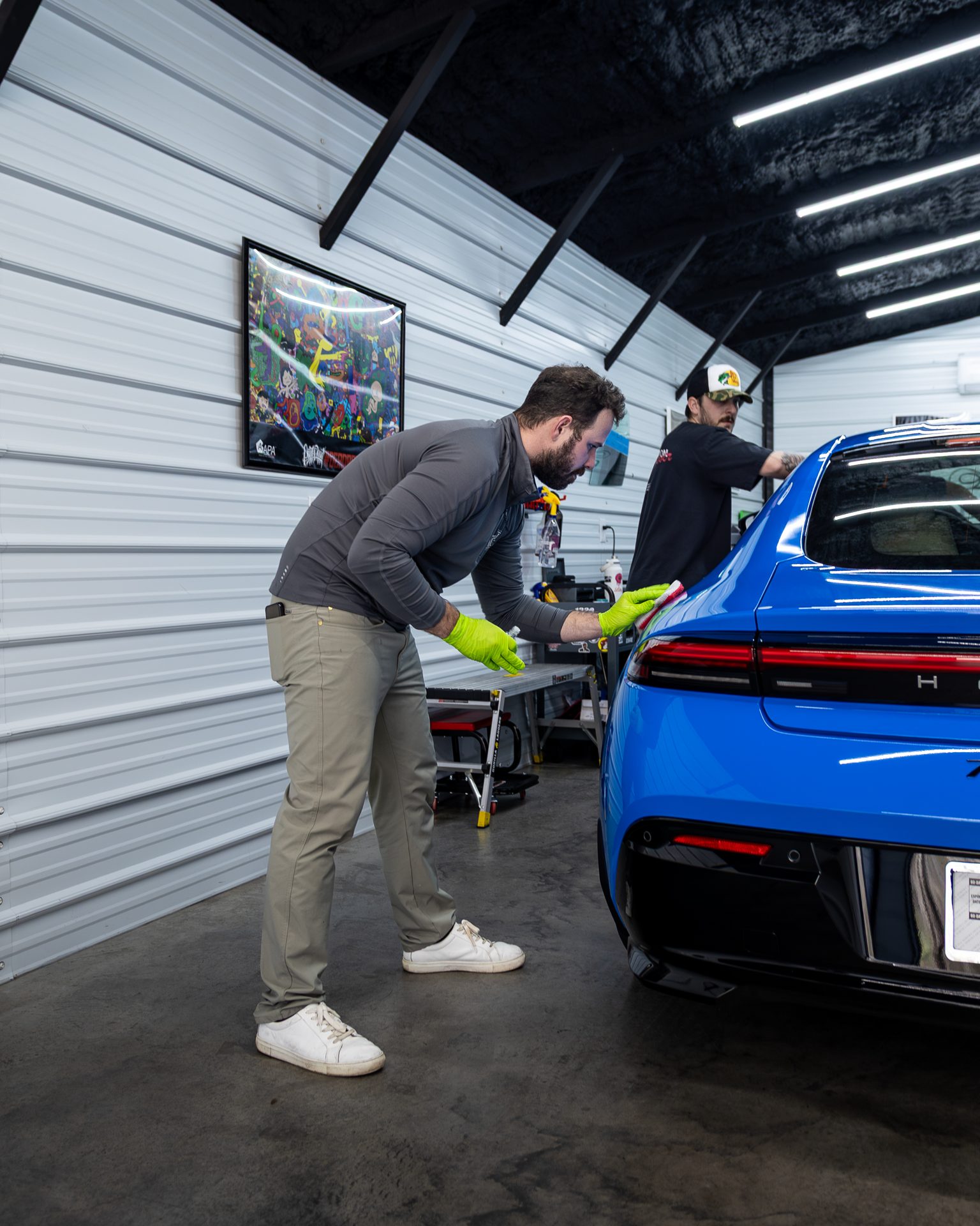 Ceramic coating being applied to a vehicle in the studio