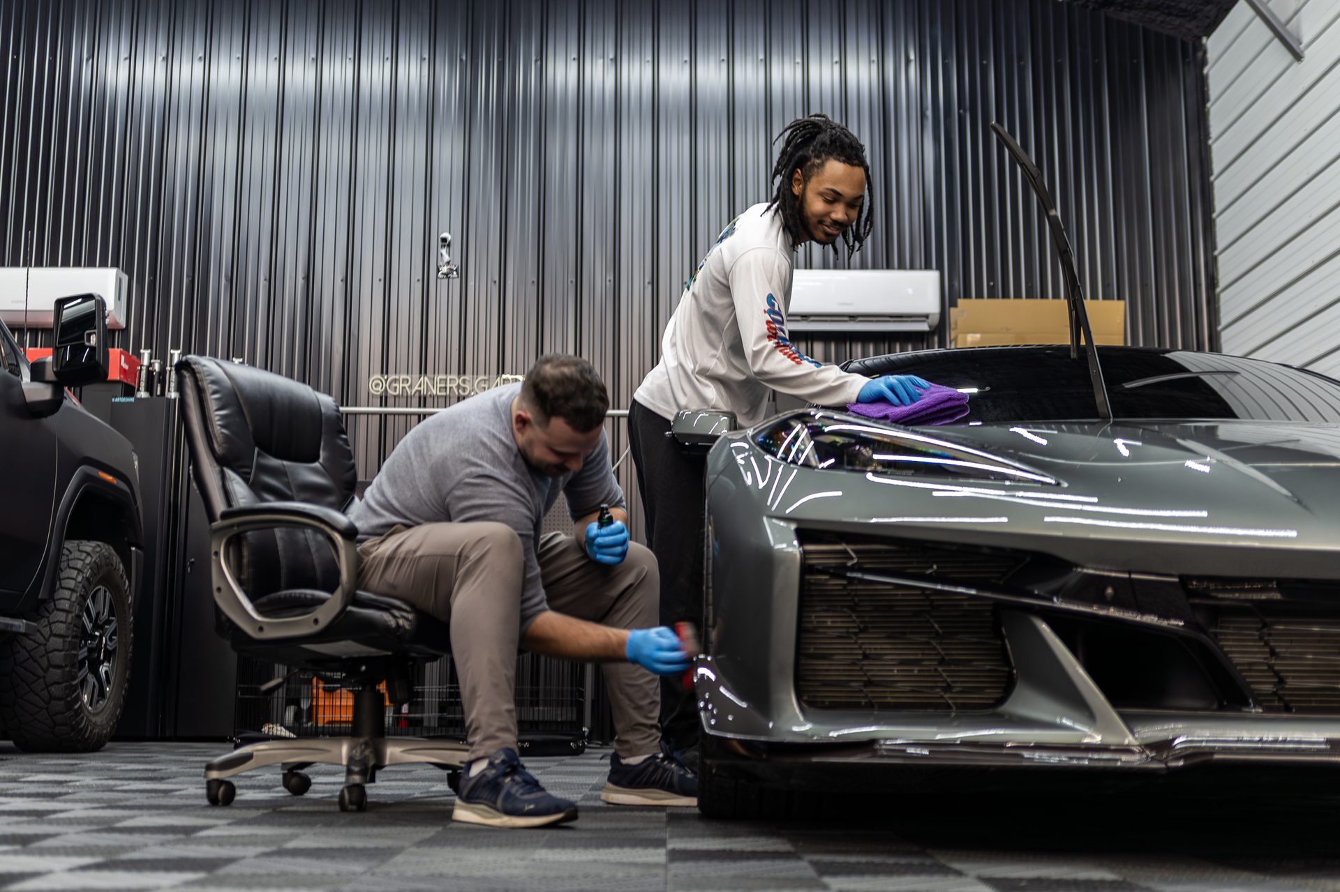 Ceramic coating being applied during a protection install
