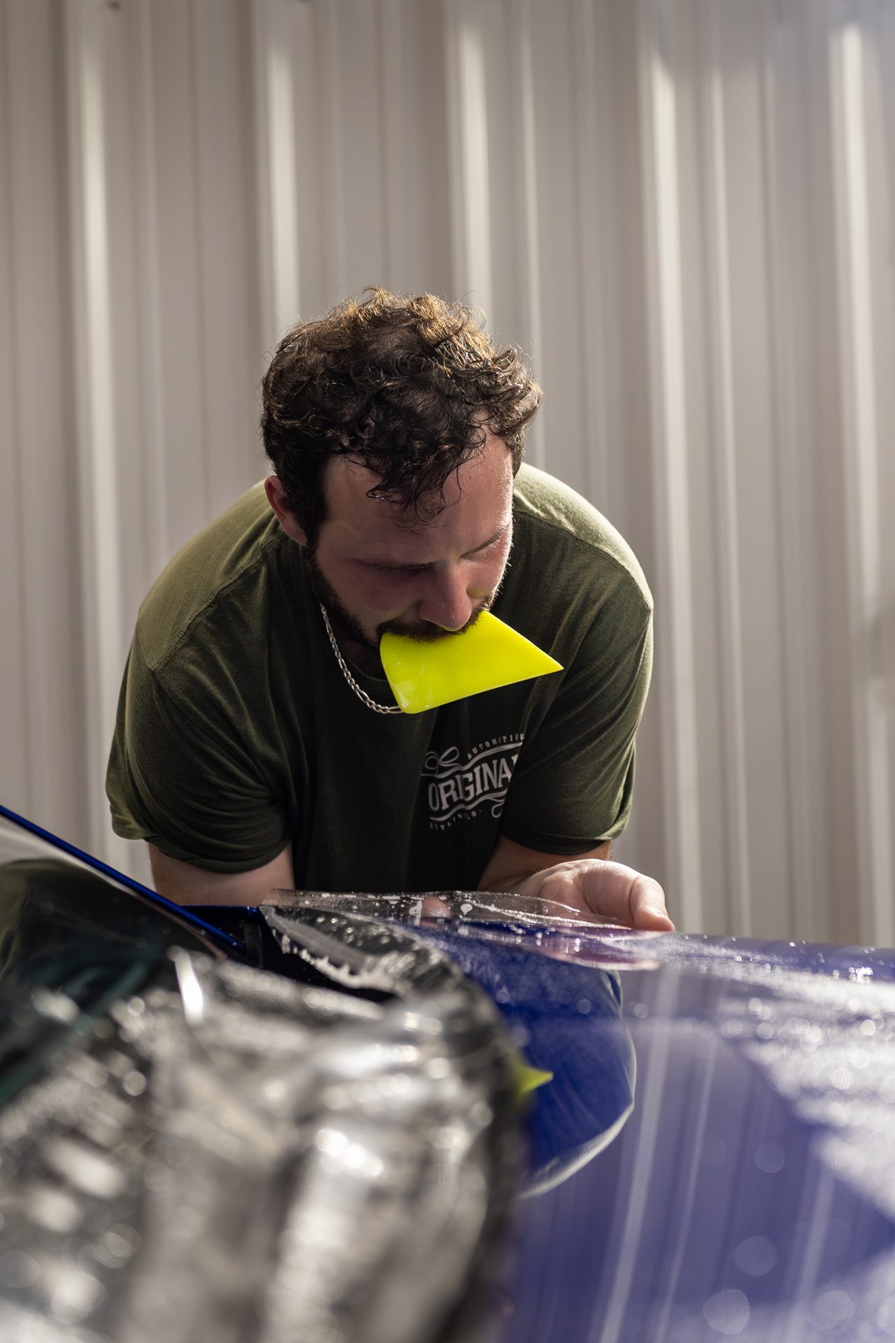 Paint protection film being installed on a vehicle roof