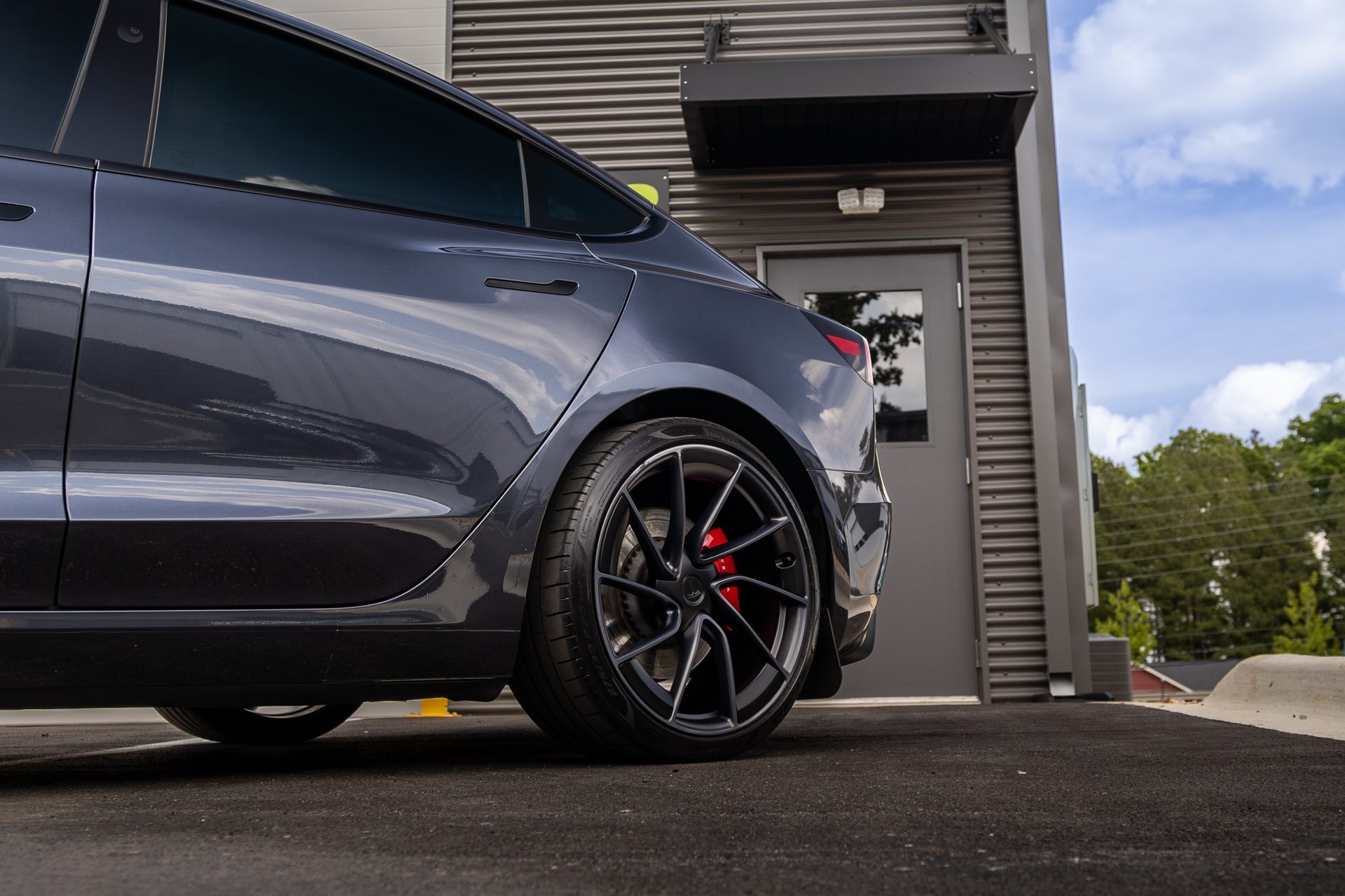 Premium Tesla detailed and ready outside the shop