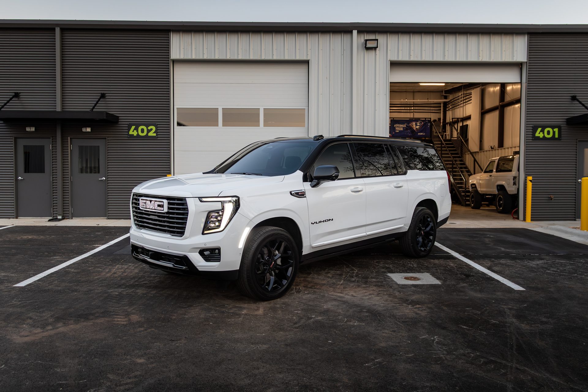 GMC Yukon outside the shop bay